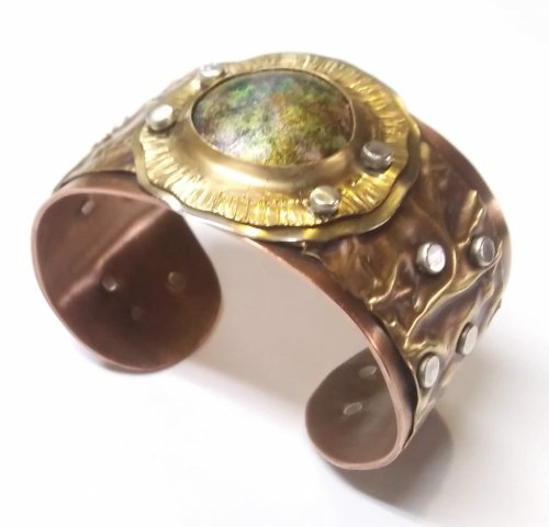 Judy Larson's Fold Formed Cuff With Faux Roman Glass or Coin Cabochon - , Metalwork, Cutting, Cutting Tool, Cutters, Dapping, Dapping Jewelry, Filing, Finishing, Forging, Forging Jewelry, Jewelry Forging, How To Punch Holes, Hole Punching, Punch A Hole, Oxidizing Wire, Oxidizing, Antiquing Wire, Antiquing, Riveting, Riveting Techniques, Wire Rivets, Sawing, Saw, Wire Saw, Texturing, Drilling, Drill, Fold Formed Faux Roman Glass Cuff